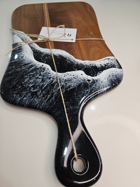 Hand-poured resin and hardwood cheese board by Art by Rafaela with black ocean waves and white seafoam — handmade Australian art homewares